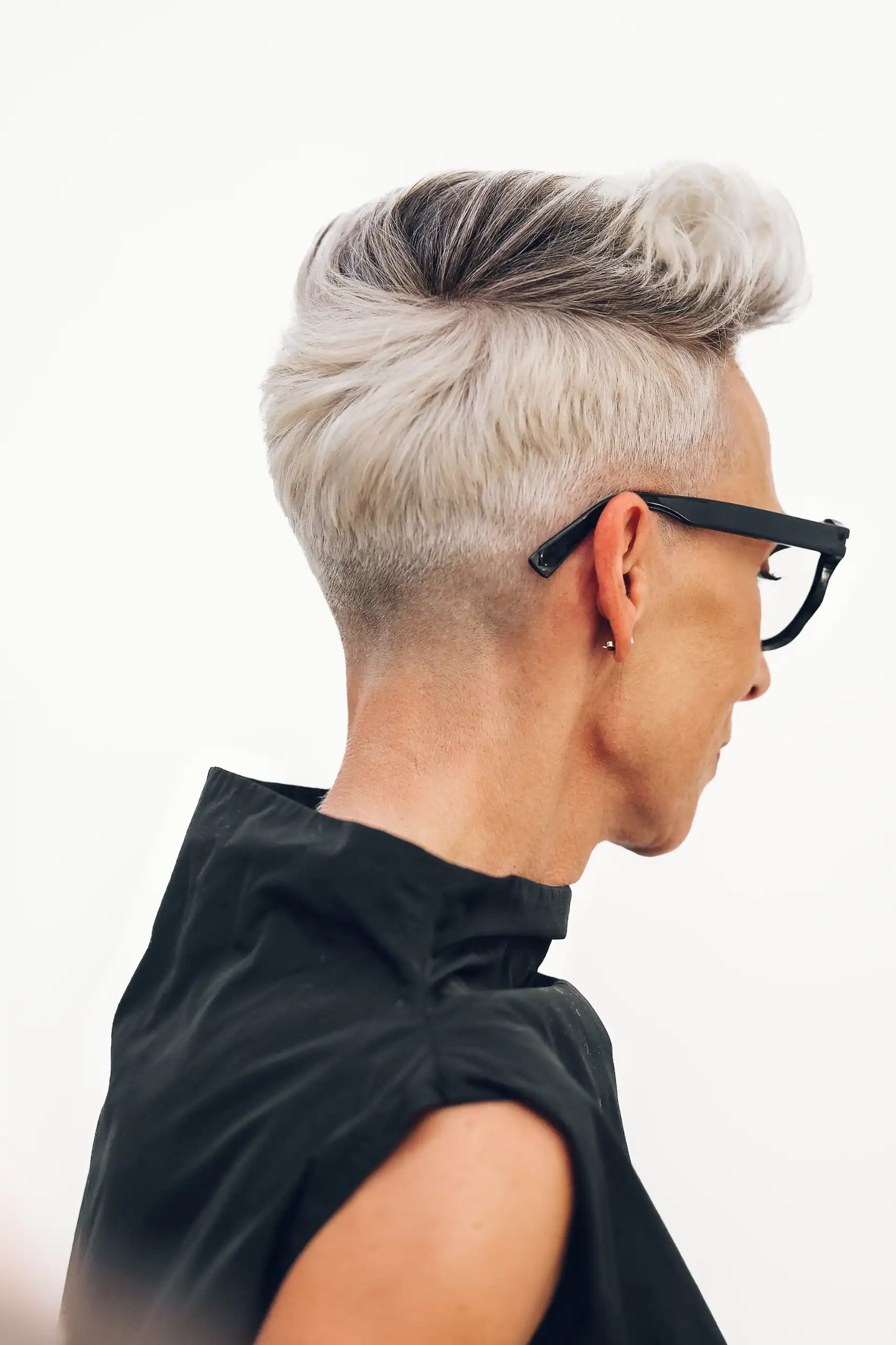 Profile of a short grey haircut
