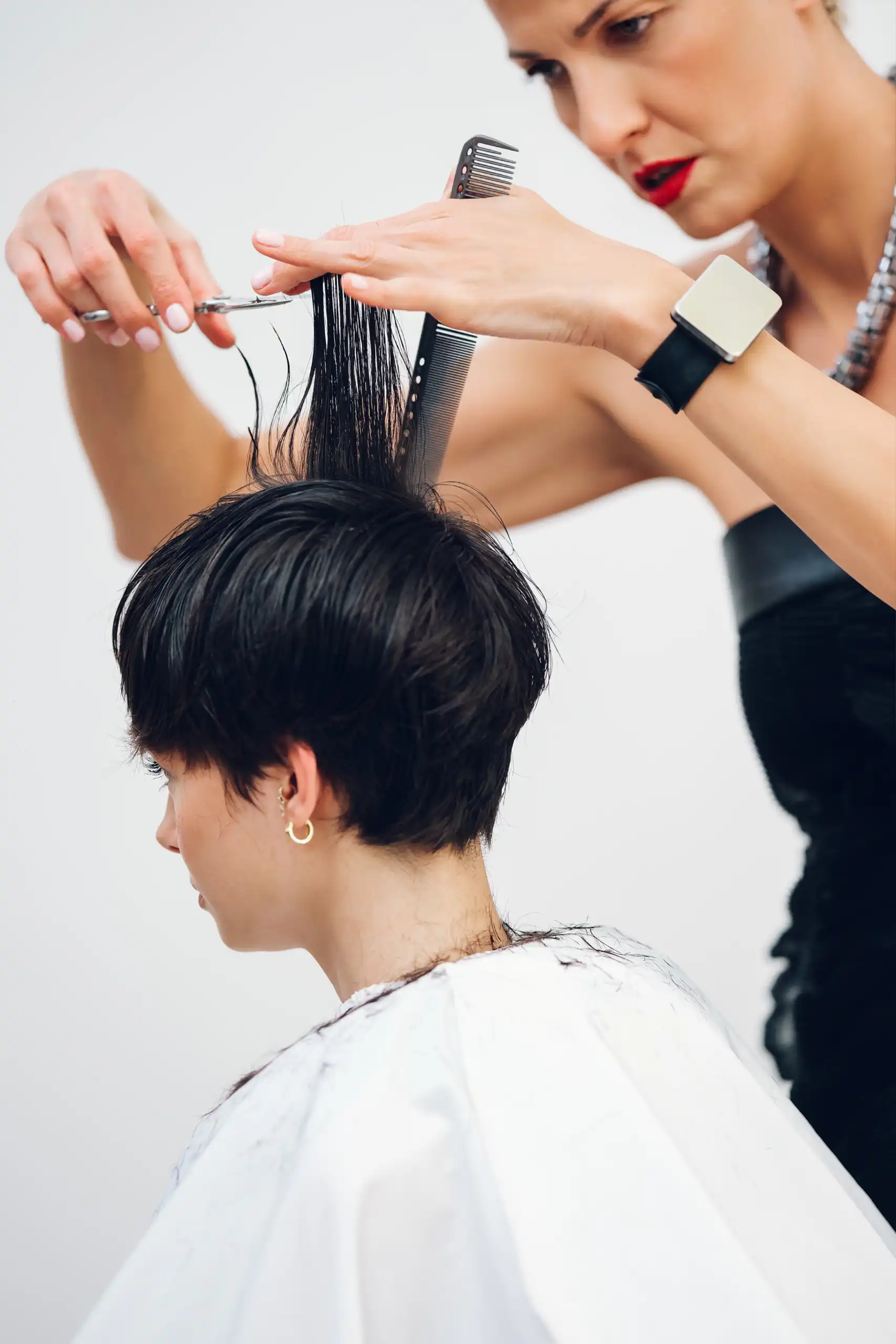 Pixie cutting demonstration on a salon model